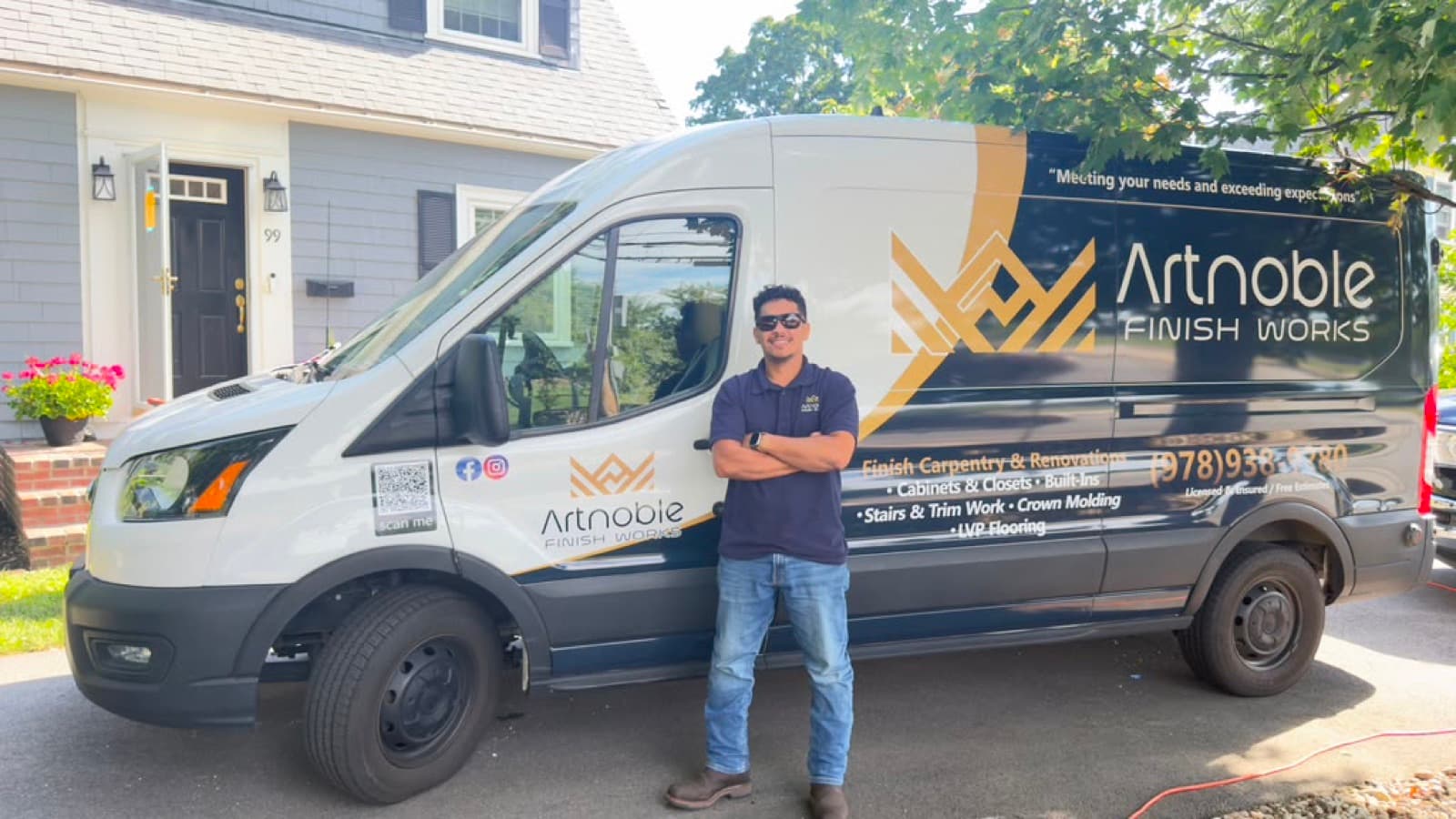 Vinicius Ferreira, owner of Artnoble Finish Works, in front of the company van in Massachusetts