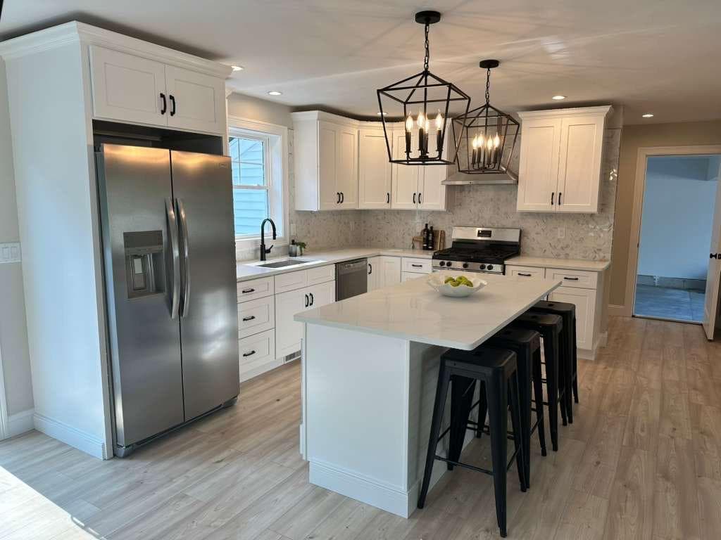 Custom white kitchen finish carpentry by Artnoble Finish Works in Massachusetts